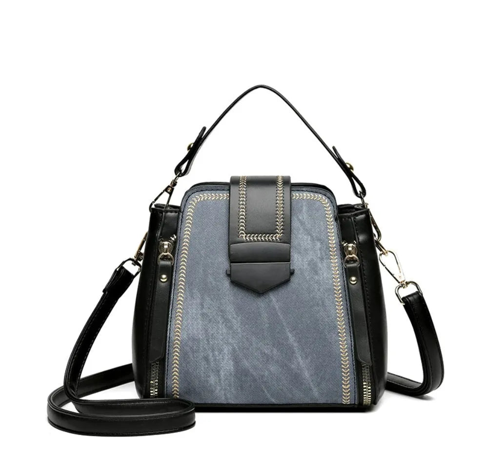 Soft PU leather ladies handbag with textured surface and sewing thread detailing in square vertical shape