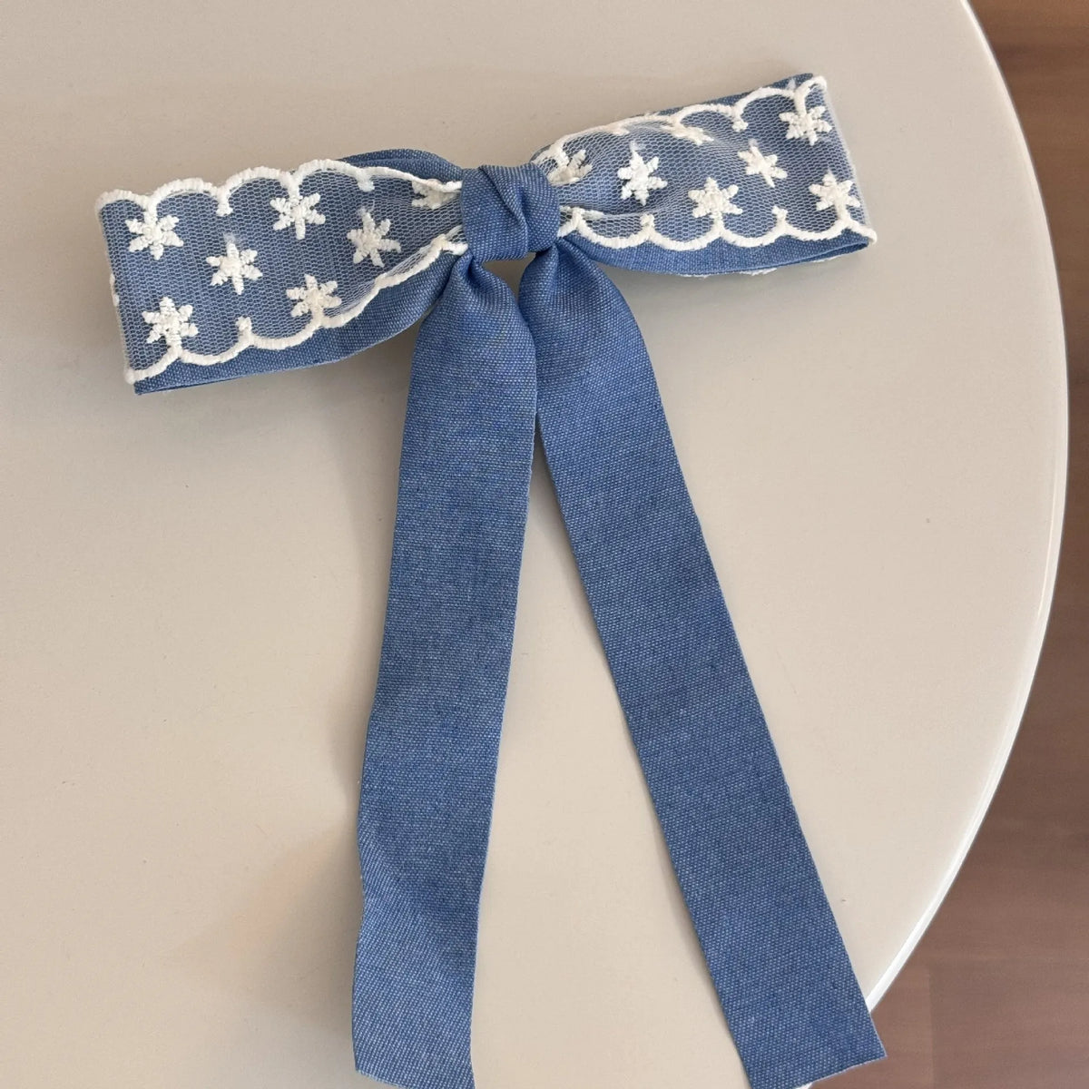 Cloth barrette hairpin set showing blue bow, beige lace, and pearl butterfly designs