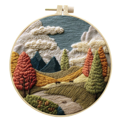 Embroidery DIY landscape kit with bamboo frame, printed fabric, thread, and needles for textile art