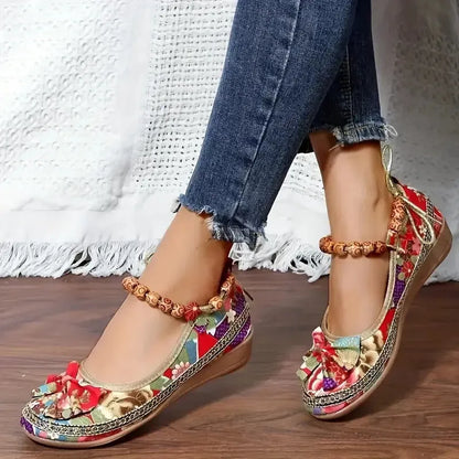 Women's black plus size ethnic style platform sandals with elastic band and cloth upper.