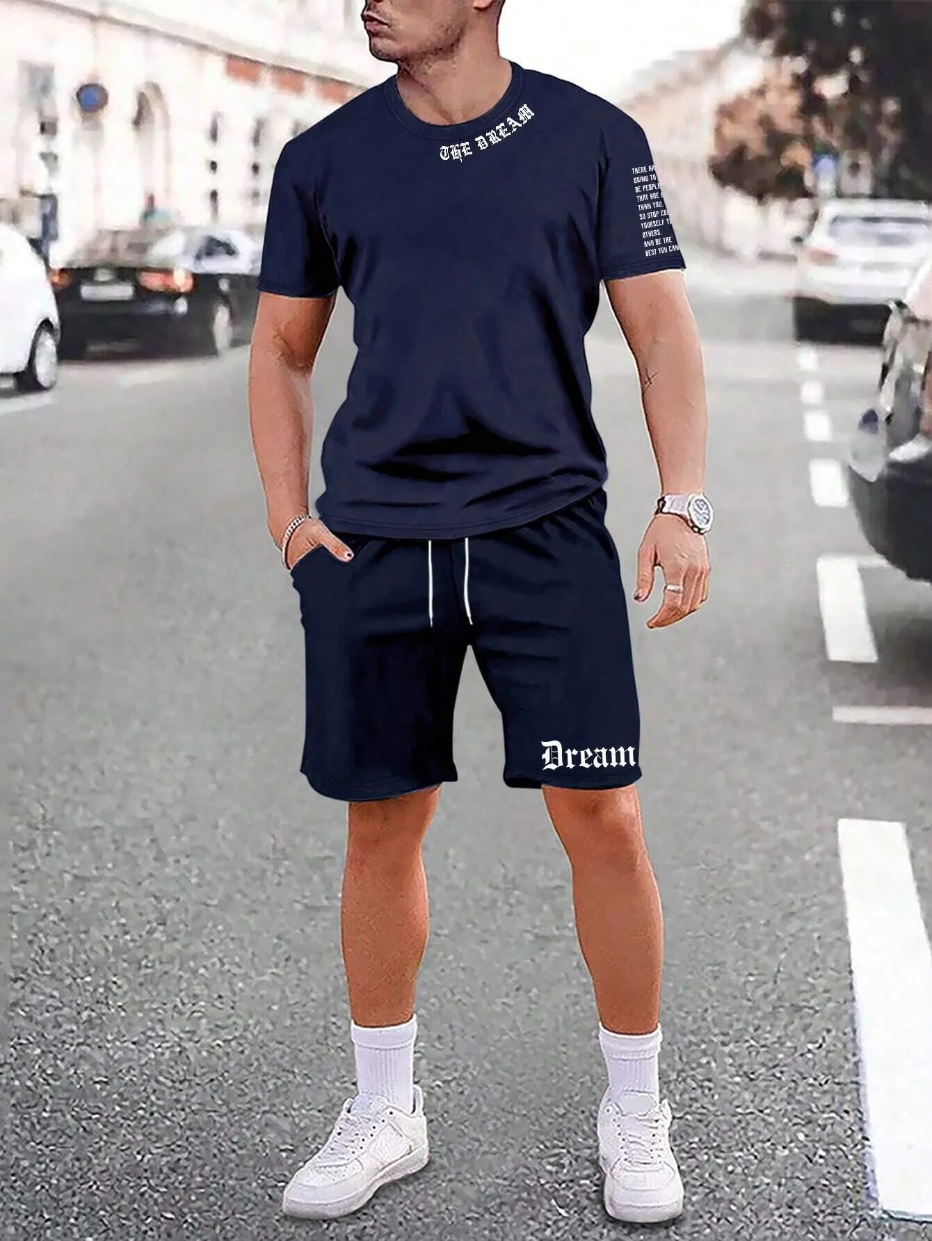 Man wearing a printed short-sleeve top and matching shorts from the sports style two-piece set.
