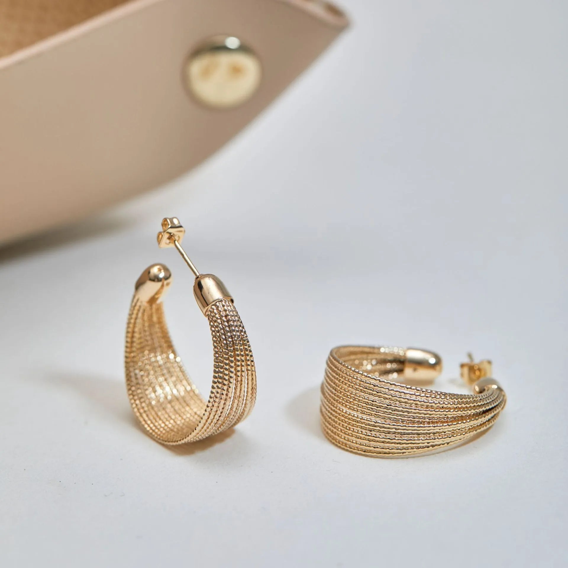 Geometric copper earrings set with gold and silver electroplated finish showing clip and stud options