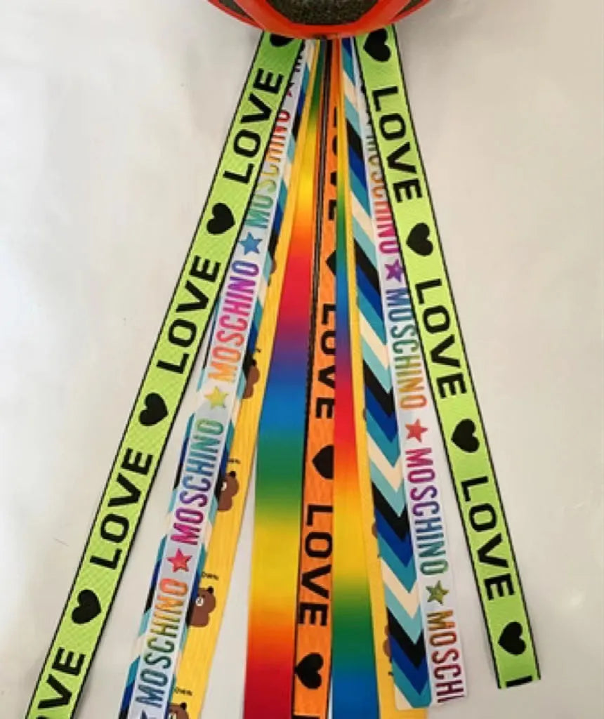 Children's helmet streamer with 60 cm polyester ribbon in colours like apricot and khaki for roller skating and skiing