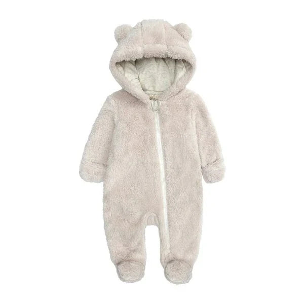 Adorable baby wearing a cozy polyester and cotton hooded jumpsuit with a cute bear-ear design