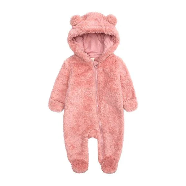 Adorable baby wearing a cozy polyester and cotton hooded jumpsuit with a cute bear-ear design