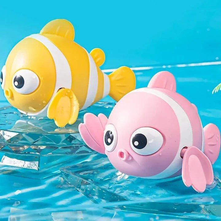 A pink wind-up swimming fish toy for babies and toddlers to play with during bath time.