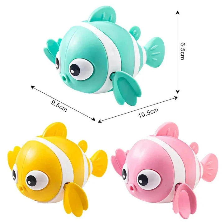 A pink wind-up swimming fish toy for babies and toddlers to play with during bath time.