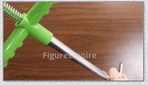 A standing weed puller tool with a long handle and 3-pronged head, designed to easily remove weeds from the root.