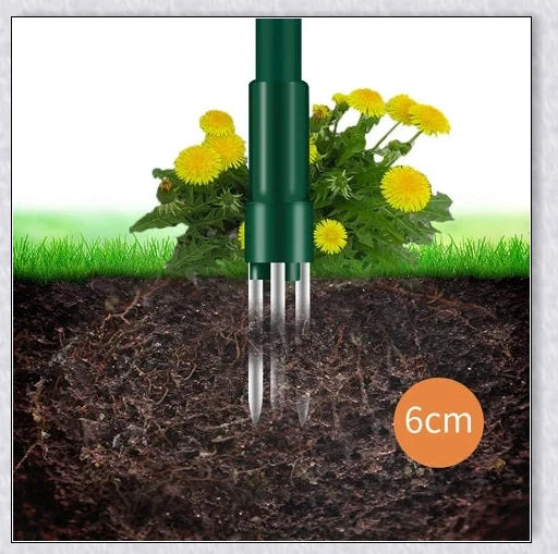 A standing weed puller tool with a long handle and 3-pronged head, designed to easily remove weeds from the root.
