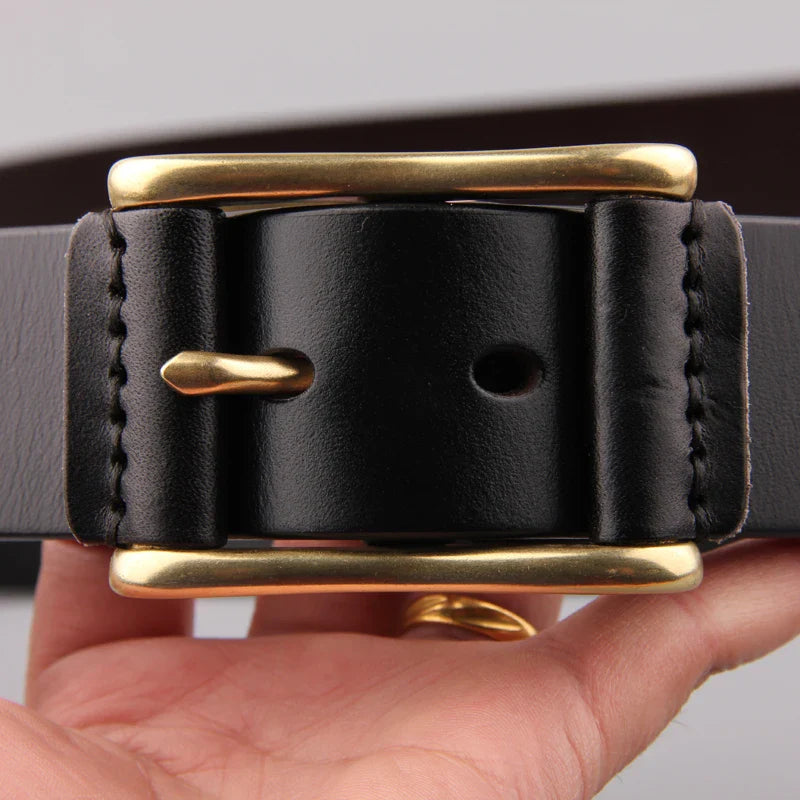Premium brass buckle men's belt in casual denim fabric, featuring a timeless and sophisticated design for versatile wear.