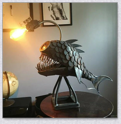 Steampunk angler fish-shaped lamp with rustic iron art tube design and warm, ambient lighting