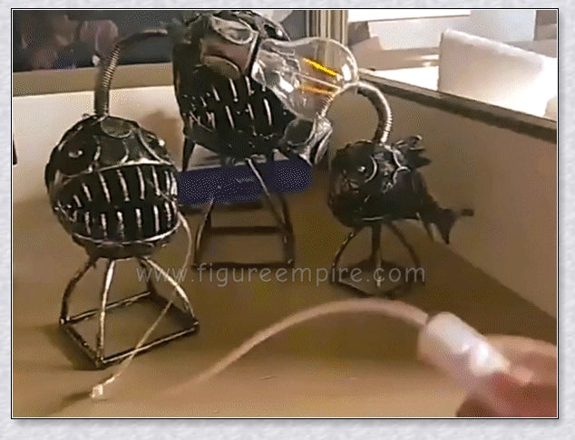 Steampunk angler fish-shaped lamp with rustic iron art tube design and warm, ambient lighting