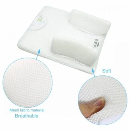 Newborn baby sleeping comfortably on the Baby Sleep Fixed Position & Anti Roll Pillow, with elevated head and air vent bumpers for optimal breathing and cooling.
