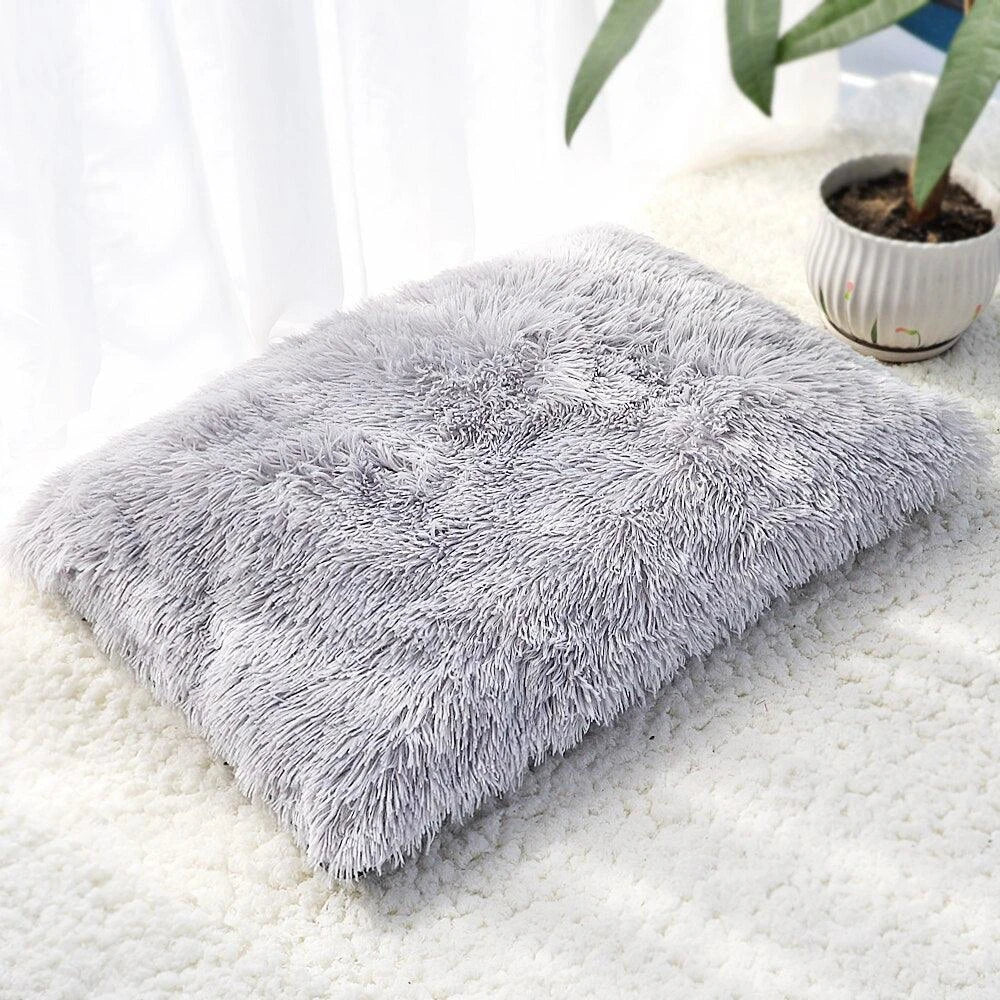 A cozy and plush pet bed in various color options, designed to provide ultimate comfort and relaxation for your furry friend.