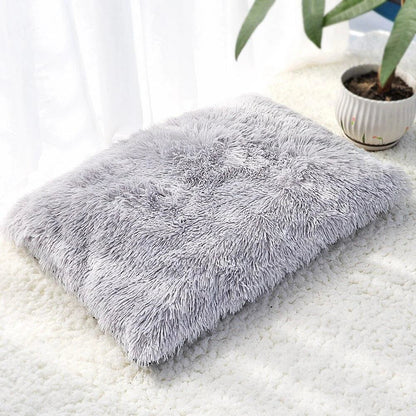 A cozy and plush pet bed in various color options, designed to provide ultimate comfort and relaxation for your furry friend.