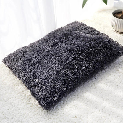 A cozy and plush pet bed in various color options, designed to provide ultimate comfort and relaxation for your furry friend.