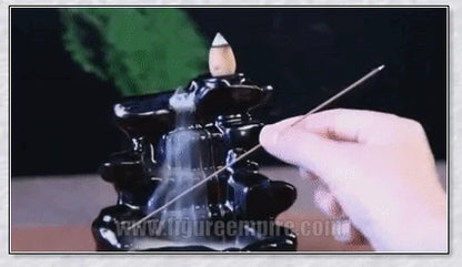 A multi-layered ceramic incense burner creating a cascading waterfall effect with calming aroma diffusion