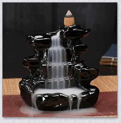 A multi-layered ceramic incense burner creating a cascading waterfall effect with calming aroma diffusion
