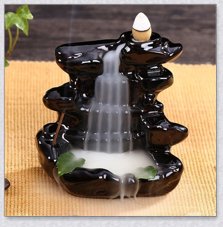 A multi-layered ceramic incense burner creating a cascading waterfall effect with calming aroma diffusion