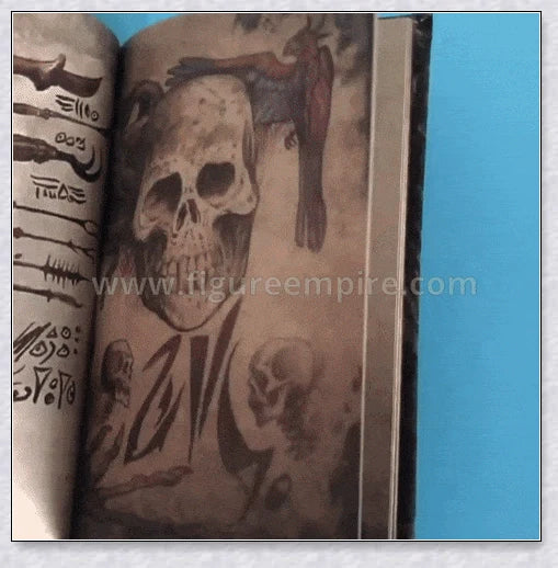 Necronomicon-inspired dark magic prop book with demonic face binding and barbed wire wrapping