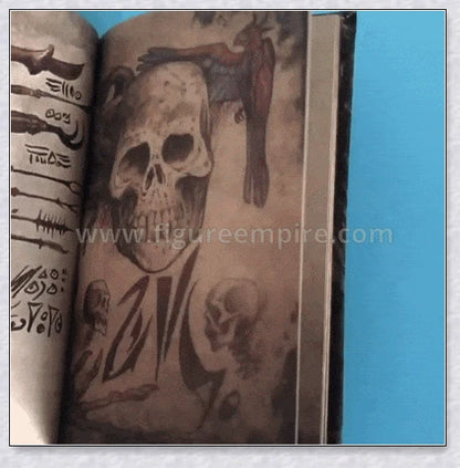 Necronomicon-inspired dark magic prop book with demonic face binding and barbed wire wrapping