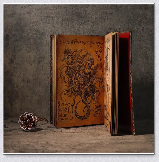 Necronomicon-inspired dark magic prop book with demonic face binding and barbed wire wrapping
