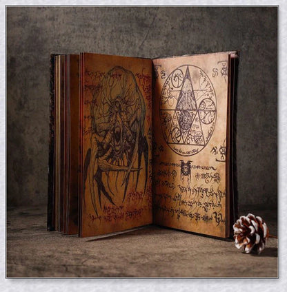 Necronomicon-inspired dark magic prop book with demonic face binding and barbed wire wrapping