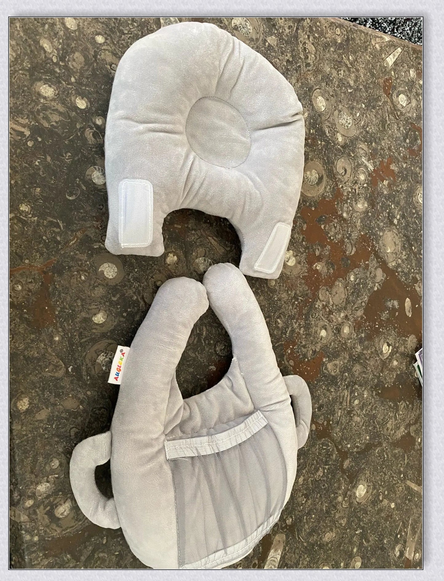 A soft, supportive pillow designed for hands-free baby feeding, featuring a secure bottle holder and premium, BPA-free materials.