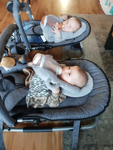 A soft, supportive pillow designed for hands-free baby feeding, featuring a secure bottle holder and premium, BPA-free materials.