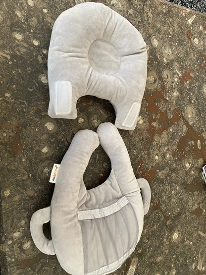 A soft, supportive pillow designed for hands-free baby feeding, featuring a secure bottle holder and premium, BPA-free materials.