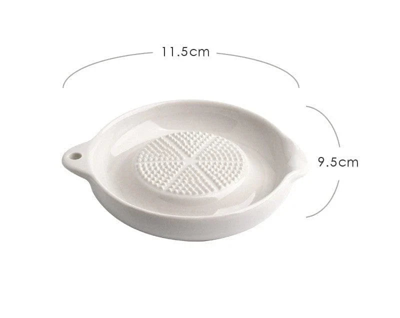 A ceramic ginger grater with a sleek, blade-free design for safe and efficient grating in the kitchen.