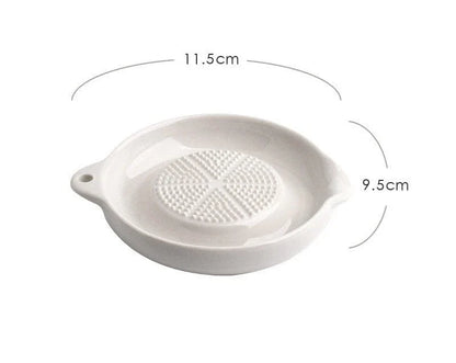 A ceramic ginger grater with a sleek, blade-free design for safe and efficient grating in the kitchen.