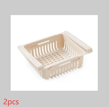 Plastic telescopic refrigerator storage basket in apricot colour, showing multiple compartments for organisation.