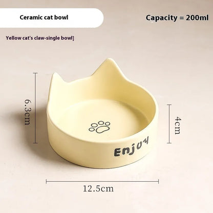 Porcelain cat bowl with anti-tumble wooden frame in pink with a cat paw design