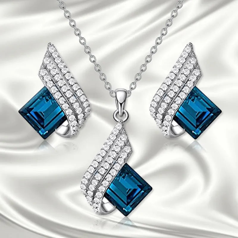 Women's alloy pendant and glass necklace with matching electroplated ear studs in cross chain style.