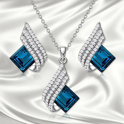 Women's alloy pendant and glass necklace with matching electroplated ear studs in cross chain style.