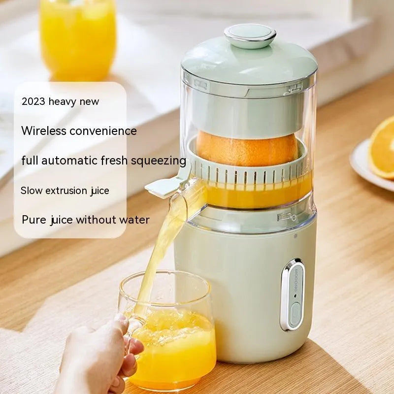 Fresh green portable electric juicer with USB charging cable and orange on a wooden table