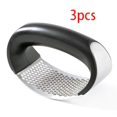 Stainless steel garlic press with uniform mincing holes measuring 10.5cm in length