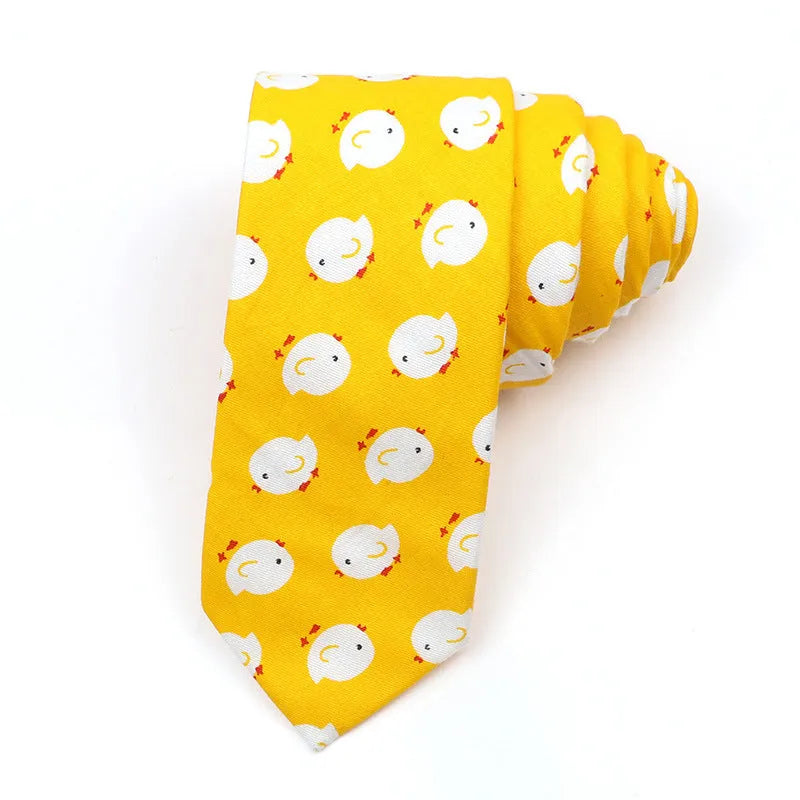 A narrow Korean-style cotton bow tie featuring a cartoon print, shown in a selection of colours.