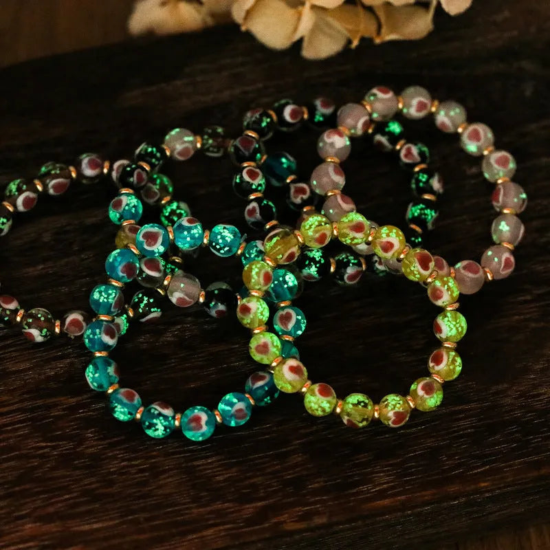 Handmade glass bracelet with 10mm swallowing gold beast cherry blossom heart charm in six colour options