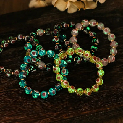 Handmade glass bracelet with 10mm swallowing gold beast cherry blossom heart charm in six colour options