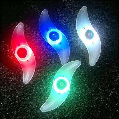 LED bicycle spoke lights in various colors mounted on bike wheel for night safety