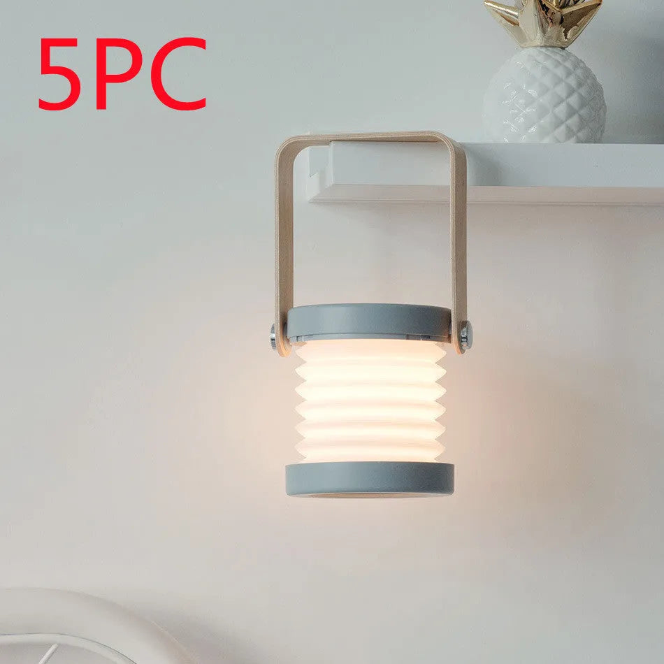 White foldable USB rechargeable LED night light in both table lamp and tall lantern modes.