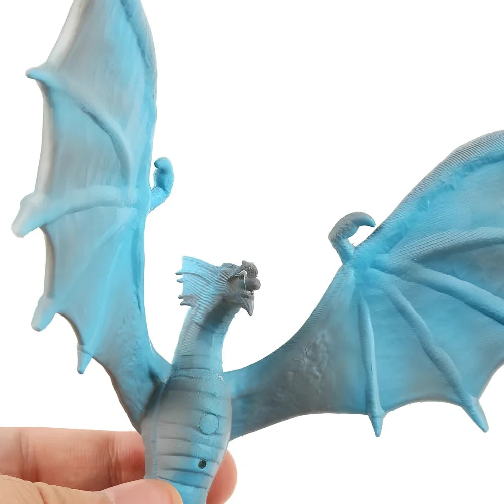 Breathing lamp with 200mm PVC shade in dragon design colours on wooden surface