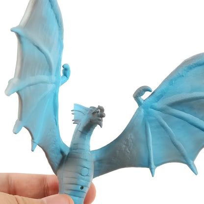 Breathing lamp with 200mm PVC shade in dragon design colours on wooden surface