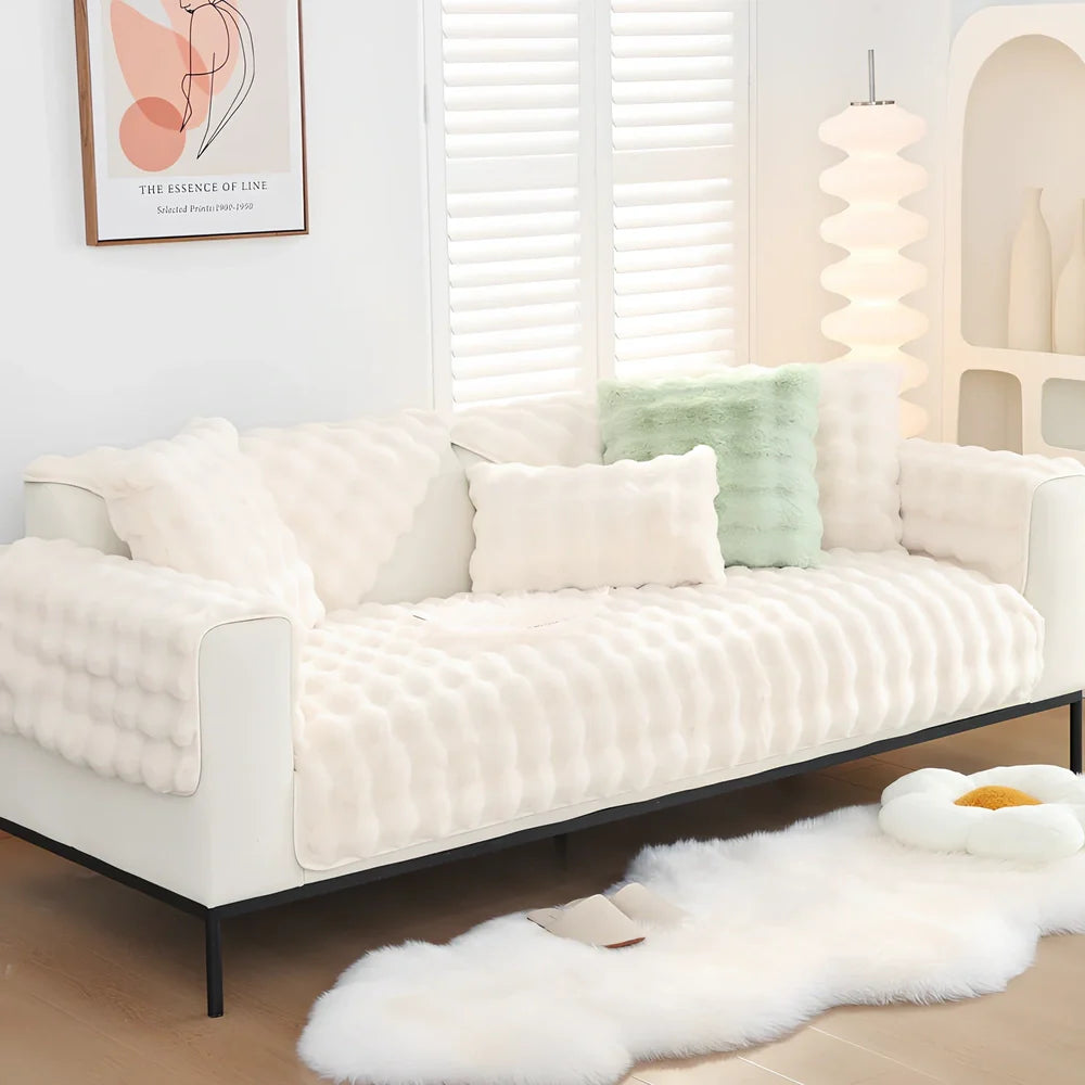 Square flannelette sofa cushion in light blue colour measuring 110x160cm on grey fabric sofa