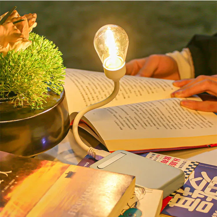 USB rechargeable folding night light with tungsten filament bulb showing warm white illumination