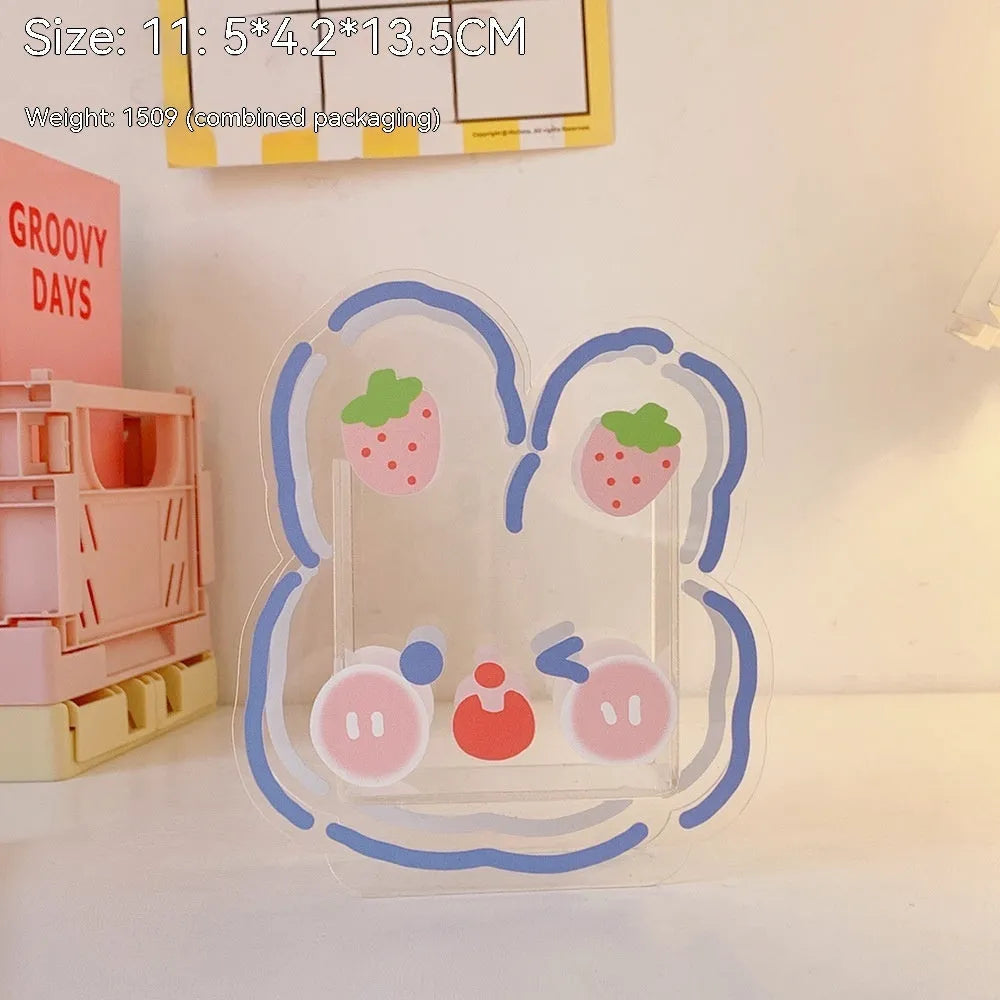 Square transparent acrylic storage box with printed character theme containing coloured pens