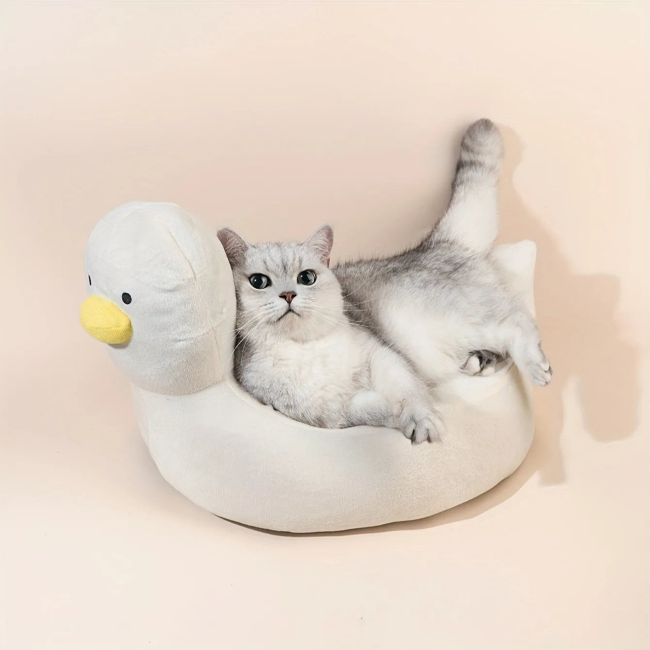 Blue duck shape fluffy pet bed sofa for small dogs and cats on a wooden floor
