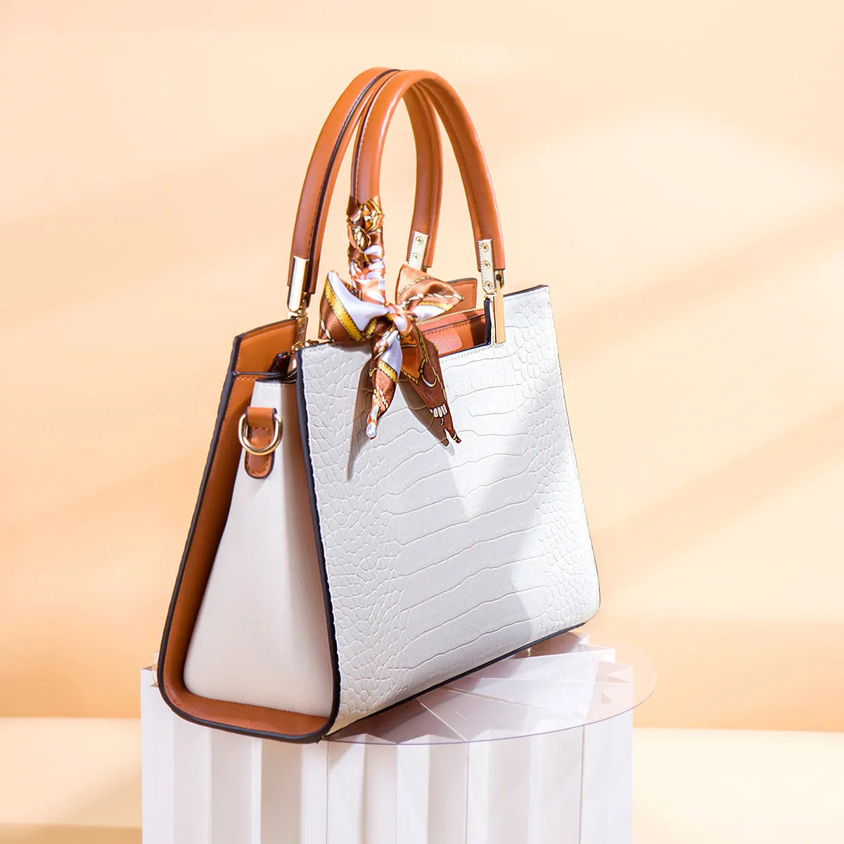 Milky white women's large shoulder handbag with interior organiser pockets and horizontal square shape.